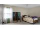 Bright bedroom with a window, soft lighting, and unique decorative screen at 702 Minus St, Saint George, SC 29477