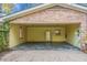 Spacious brick garage with ample room, painted walls, and a vintage refrigerator at 702 Minus St, Saint George, SC 29477