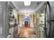 Well-designed kitchen showcasing wood counters, stainless steel appliances, hardwood floors, and an open floorplan at 702 Minus St, Saint George, SC 29477
