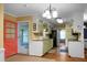 Charming kitchen with a blend of modern and vintage elements, including wood counters and hardwood floors at 702 Minus St, Saint George, SC 29477