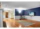 Inviting living area with hardwood floors, neutral paint, and an open layout, perfect for entertaining guests at 702 Minus St, Saint George, SC 29477