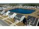 Aerial view of the house, showcasing its location within the community, its surroundings and proximity to the pond at 705 Squire Pope Rd, Summerville, SC 29486