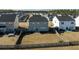 Aerial view of backyards with fencing between properties, showcasing the house, yard size, and neighborhood at 705 Squire Pope Rd, Summerville, SC 29486