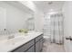 Neat bathroom featuring a gray vanity with a sink and a tub/shower with a shower curtain at 705 Squire Pope Rd, Summerville, SC 29486