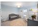 Charming Bedroom featuring a crib, rocking chair, accent rug, and soft blue walls at 705 Squire Pope Rd, Summerville, SC 29486