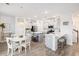 Spacious eat-in kitchen featuring stainless steel appliances, gray cabinets and an island with stools at 705 Squire Pope Rd, Summerville, SC 29486