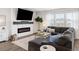 Cozy living room with a modern fireplace, large TV, and comfortable sectional sofa for relaxing evenings at 705 Squire Pope Rd, Summerville, SC 29486