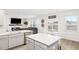 Open living space featuring a modern kitchen, dining area, and living room with fireplace at 705 Squire Pope Rd, Summerville, SC 29486