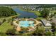 Enjoy the neighborhood pool with ample seating, lush landscaping, and lake views at 705 Squire Pope Rd, Summerville, SC 29486