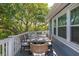 Outdoor dining area on balcony offers a stylish table and chairs with views of greenery at 73 Fairway Dunes Ln, Isle of Palms, SC 29451
