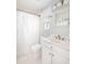 Bright bathroom features a sink vanity with a framed mirror and shower with tub at 73 Fairway Dunes Ln, Isle of Palms, SC 29451