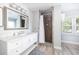 Bathroom boasts a white marble sink vanity and modern shower with glass door at 73 Fairway Dunes Ln, Isle of Palms, SC 29451