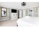 Bright bedroom with white linens, ceiling fan, large mirror and mounted TV at 73 Fairway Dunes Ln, Isle of Palms, SC 29451