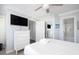 Bedroom with a flat screen television and access to an ensuite bath with walk-in shower at 73 Fairway Dunes Ln, Isle of Palms, SC 29451