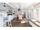 Bright and airy living room with stylish furniture, fireplace, and seamless flow to the dining area at 73 Fairway Dunes Ln, Isle of Palms, SC 29451