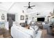 Bright and airy living room with high ceilings, neutral decor, and a view into the dining area at 73 Fairway Dunes Ln, Isle of Palms, SC 29451