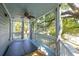 Covered porch with hot tub and curtains that provide privacy while enjoying the view at 73 Fairway Dunes Ln, Isle of Palms, SC 29451