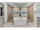 Modern bathroom featuring a soaking tub, a walk-in shower with elegant tile, and stylish fixtures at 733 Oakridge View Trl, Ridgeville, SC 29472