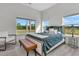 Well-lit bedroom with large windows and wood-style flooring, providing a serene and welcoming atmosphere at 733 Oakridge View Trl, Ridgeville, SC 29472