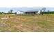 The farmhouse has a fenced-in area of green grass, landscaping, and a play area at 733 Oakridge View Trl, Ridgeville, SC 29472