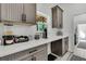 Kitchenette with white countertops, modern appliances, and custom cabinetry at 733 Oakridge View Trl, Ridgeville, SC 29472