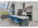 Modern kitchen featuring a large island with seating, stainless steel appliances, and an open layout at 733 Oakridge View Trl, Ridgeville, SC 29472