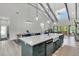Open-concept kitchen and living area featuring a large island and modern design at 733 Oakridge View Trl, Ridgeville, SC 29472