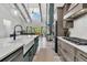 Open-concept living space with a modern kitchen, stainless appliances, and hardwood floors at 733 Oakridge View Trl, Ridgeville, SC 29472