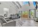 Bright living area boasts high ceilings, ample seating, and natural light at 733 Oakridge View Trl, Ridgeville, SC 29472
