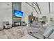 Spacious living room featuring a fireplace, seating, and open concept connecting to the kitchen at 733 Oakridge View Trl, Ridgeville, SC 29472