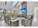 Open-concept living area features modern furnishings and seamless access to the adjacent kitchen at 733 Oakridge View Trl, Ridgeville, SC 29472