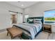 Spacious main bedroom featuring stylish furnishings, a sliding door, and natural light at 733 Oakridge View Trl, Ridgeville, SC 29472