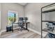 Home office with desk, office chair, two computer monitors, shelving, and large window at 733 Oakridge View Trl, Ridgeville, SC 29472