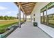Spacious porch with an open view offers great outdoor living and entertaining space at 733 Oakridge View Trl, Ridgeville, SC 29472