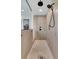 Large walk-in shower featuring elegant tile, rain shower head, and a built-in shower niche at 733 Oakridge View Trl, Ridgeville, SC 29472