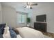 Staged bedroom with ceiling fan, area rug, and built in cabinets at 7965 Edgebrook Cir # F, North Charleston, SC 29418