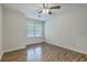 Bright bedroom with hardwood floors and a ceiling fan at 7965 Edgebrook Cir # F, North Charleston, SC 29418