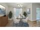 Elegant dining room features modern chandelier, stylish decor, and natural light for Gathering gatherings at 7965 Edgebrook Cir # F, North Charleston, SC 29418