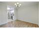 Bright dining room with hardwood floors and a view into the kitchen at 7965 Edgebrook Cir # F, North Charleston, SC 29418