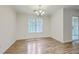 Bright dining area with chandelier and window provides a comfortable space for Gathering meals at 7965 Edgebrook Cir # F, North Charleston, SC 29418