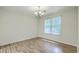 Bright dining room with hardwood floors and a large window with blinds at 7965 Edgebrook Cir # F, North Charleston, SC 29418