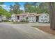 Exterior of well-maintained townhome complex with landscaped grounds and parking at 7965 Edgebrook Cir # F, North Charleston, SC 29418