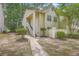 Charming condo with inviting walkway and well-maintained landscaping in a lush, green community at 7965 Edgebrook Cir # F, North Charleston, SC 29418