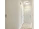 A clean and simple hallway featuring light walls, neutral flooring, and doors at 7965 Edgebrook Cir # F, North Charleston, SC 29418