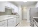 Bright kitchen with stainless steel appliances and white cabinets at 7965 Edgebrook Cir # F, North Charleston, SC 29418