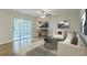Bright living room features a cozy fireplace, stylish decor, and sliding glass doors to a patio at 7965 Edgebrook Cir # F, North Charleston, SC 29418
