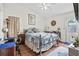Cozy bedroom features a ceiling fan, wood floors, and a large bed with patterned bedding at 801 Reserve Way, Summerville, SC 29485