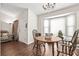 Home's dining room features a bay window, hardwood floors, and lots of natural light at 801 Reserve Way, Summerville, SC 29485