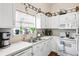 Classic white kitchen with appliances, including a microwave, toaster and other storage spaces at 801 Reserve Way, Summerville, SC 29485