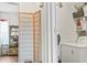 This shows the entrance to the laundry room with a washer and dryer, plus storage shelving at 801 Reserve Way, Summerville, SC 29485